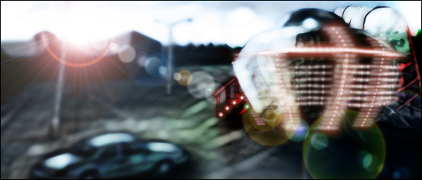 Sunrise at empty parking lot with one amusement ride