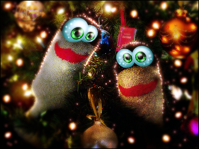 Fanciful woodland creatures smile cheerfully from a Christmas tree